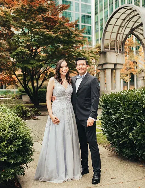 A bride and groom stand in formal attire. Captured by Wedding Photographer Vancouver