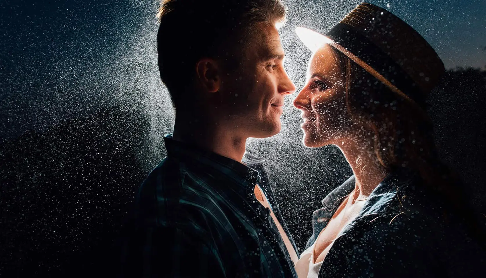 The bride and groom are kissing, in the dark, captured by Wedding Photographer Vancouver